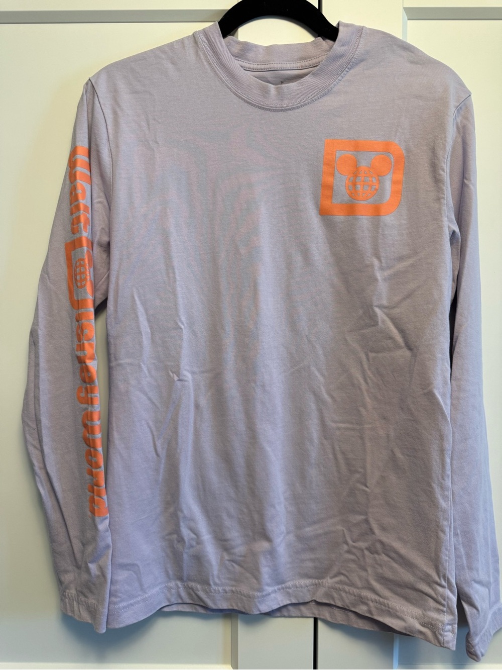 Women's Long Sleeve Crewneck Tee in Light Lavender with Orange Logo